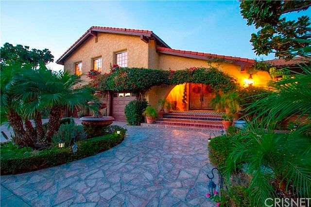 Front Exterior with fountain, slate walkway and hand painted Spanish tile steps