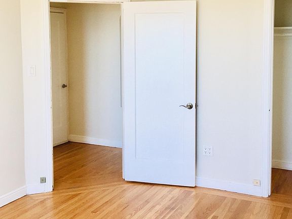 closet in 2nd bedroom and view of in-unit laundry room (door closed)