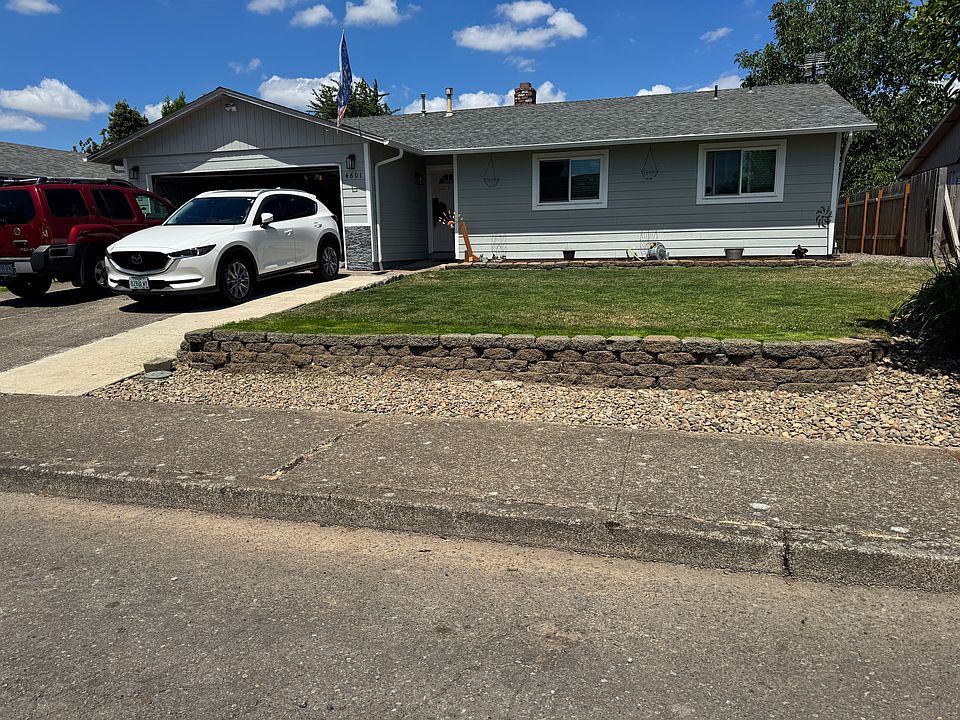 Front of house. Before 8/1, front door will be painted black and have a new garage door.