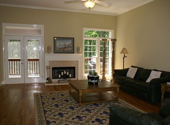 Huge, sunny living room with french doors to screened porch 