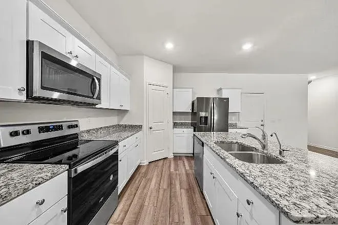 Brand new stainless steel appliances.