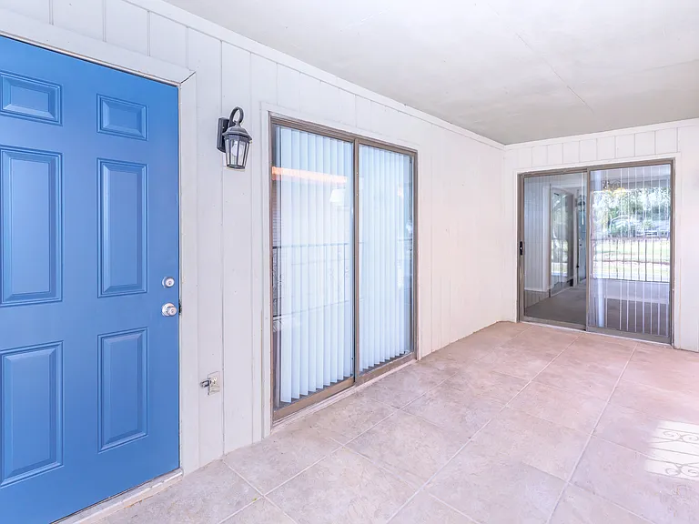Townhome double access sliding doors to a huge spacious balcony, storage unit included