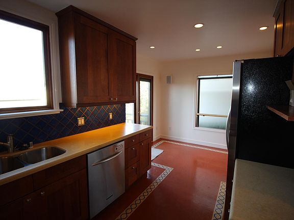 Kitchen with breakfast nook near door to deck