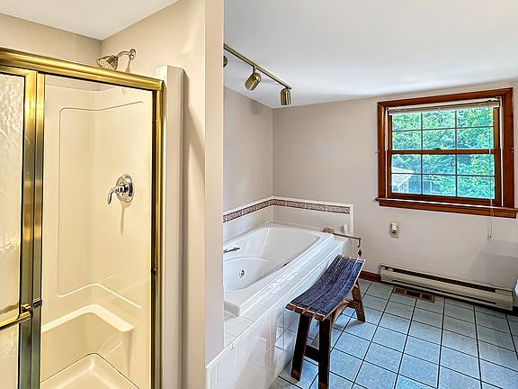 Main 2nd floor bathroom with Whirlpool Jet Tub, with a stand up shower.