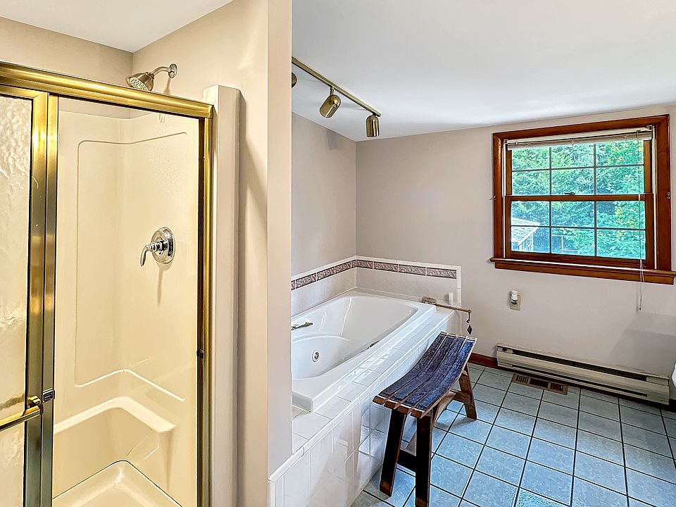 Main 2nd floor bathroom with Whirlpool Jet Tub, with a stand up shower.