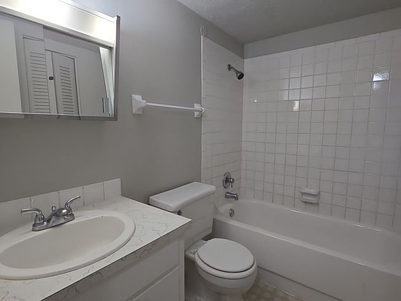 Bathroom with tub and shower combo