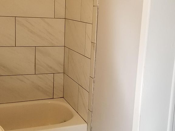 Totally remodeled bath. New tub, shower area, sink, toilet, fresh paint, new tile tub surround n floors, new vent fan. Lite Bright n Beautiful (Jack n Jill Bath)