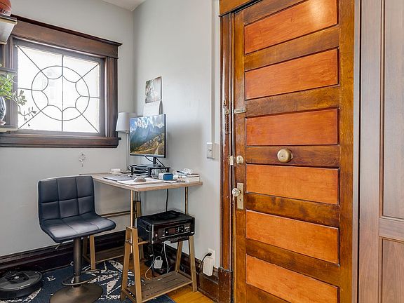 Spacious front entry perfect for office, or reading nook.