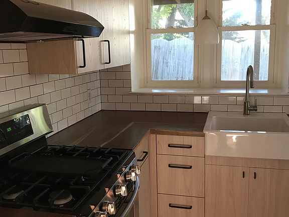 All updated kitchen with view of backyard