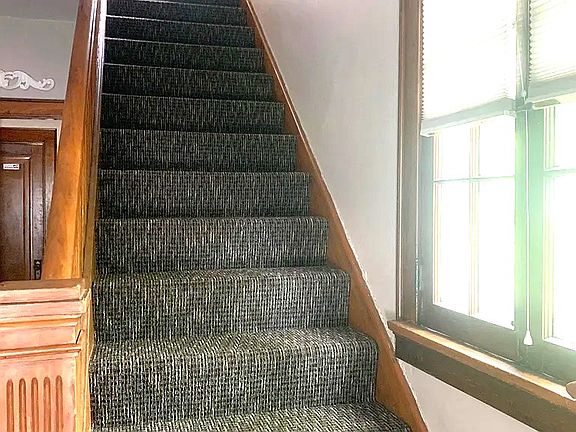 Carpeted Entry stairs to top unit.