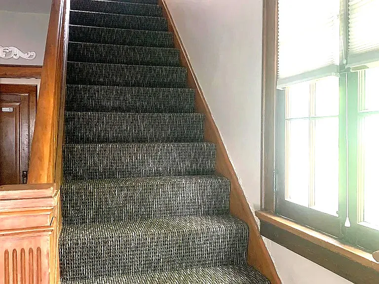 Carpeted Entry stairs to top unit.