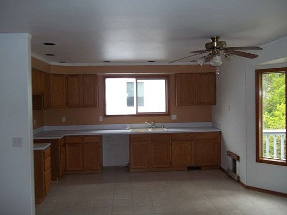 Spacious, open kitchen with bay window for eating area