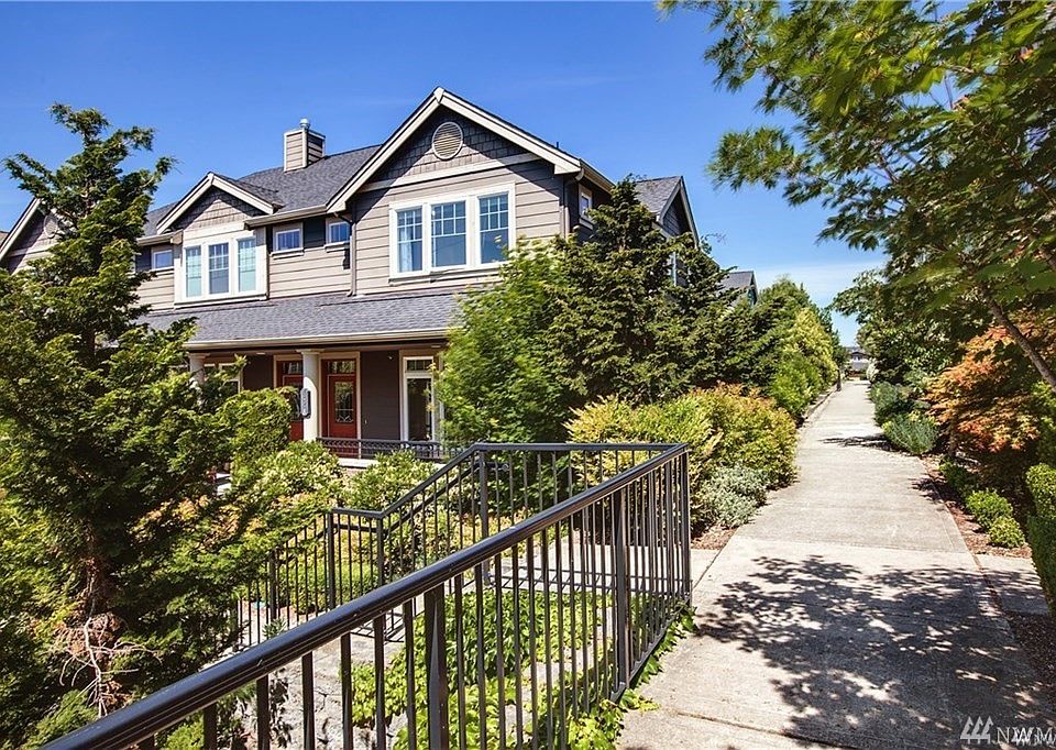 Arboretum townhomes offer distinctive architectural detailing with extensive use of brick or stone masonry. Welcome home!  This former model home is ideally located on a corner with plenty of light yet tons of privacy.