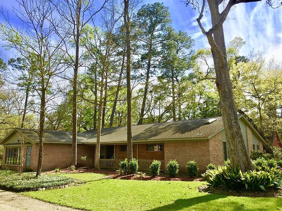 This beautiful home sits on almost an acre lot nestled in the trees.