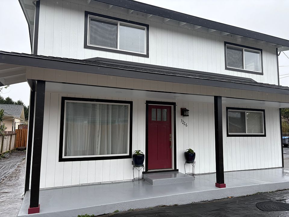 Front of house w/ main entrance, full covered porch