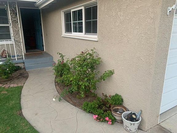 Front walkway with two steps into home.