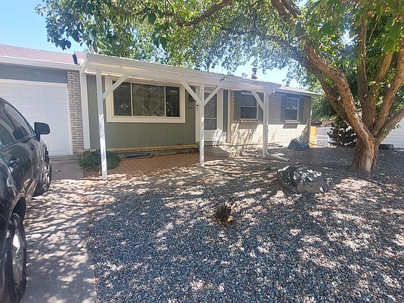 Lovely covered patio, shade trees, rock yard for easy maintenance