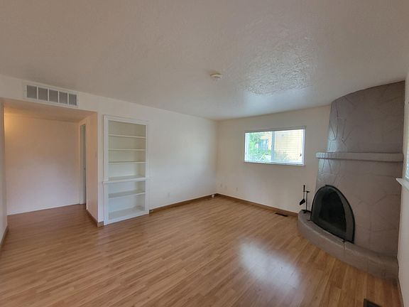 Spacious Living Room with wood burning Kiva Fireplace.