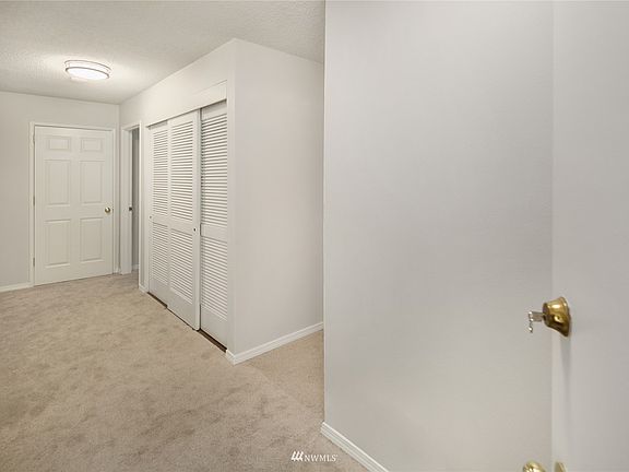 Entry way of the unit with fresh paint & carpet