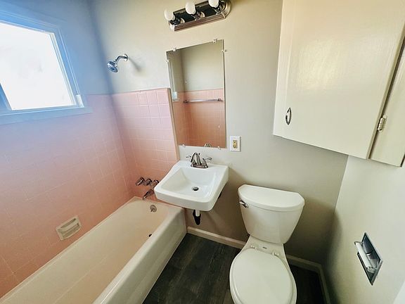 Vintage Bathroom look with new faucets and new toilet.