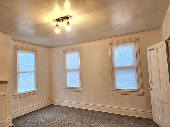 Master Bedroom with a closet and multiple windows for natural light