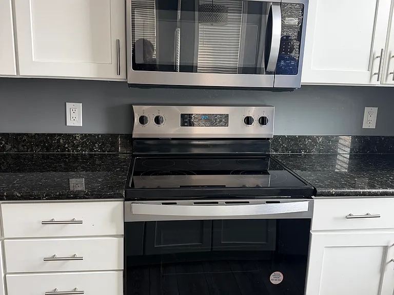 New stainless steel cooktop stove and new microwave