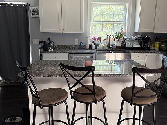 Kitchen with Granite countertops and island