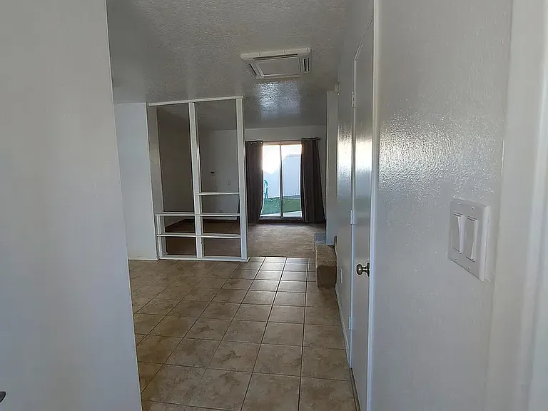 Front door, dining room, living room, sliding door to backyard