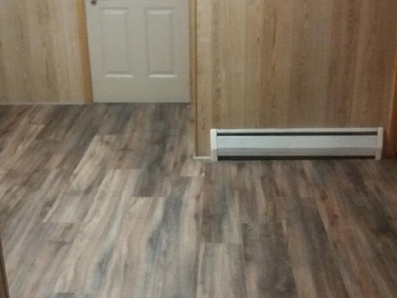 Kitchen - back door leading to porch - plank flooring