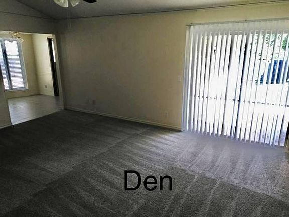 Den with fireplace.