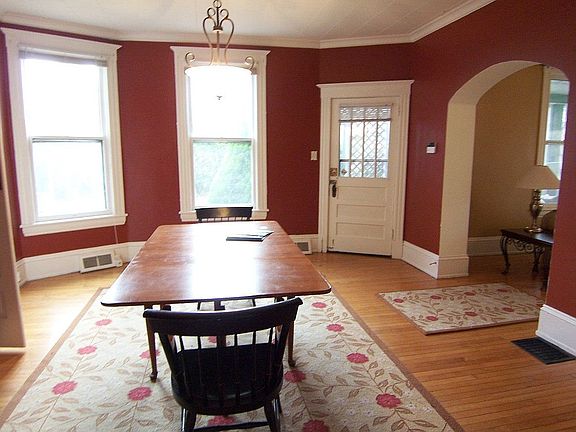 Formal Dining room has maple floors, built-ins and fireplace.