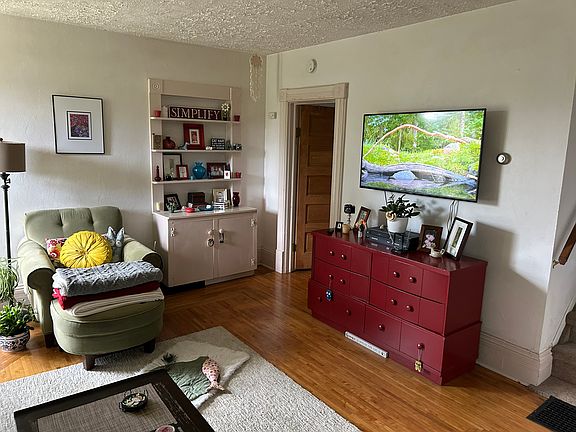 living room, built in bookshelf & cabinet