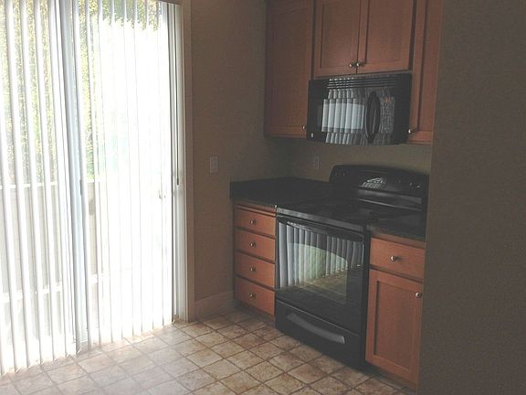 Kitchen opens to view patio