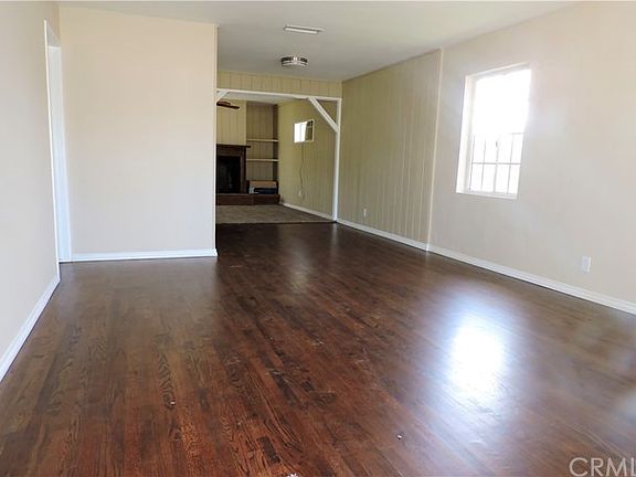 Living room with dining area and looking into family room