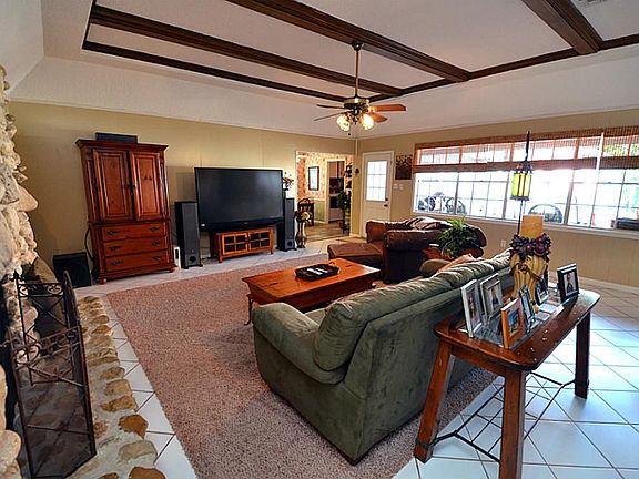 Upon entering this home is a large family room with tiled floor and great space.