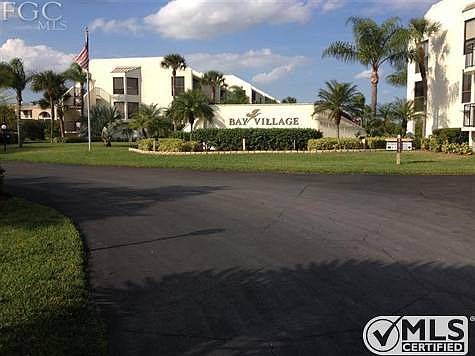ENTRANCE TO WELL MANICURED BAY VILLAGE CONDOS