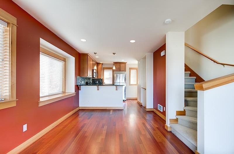 2nd floor: Kitchen & living area. Lots of windows, hardwood floors.