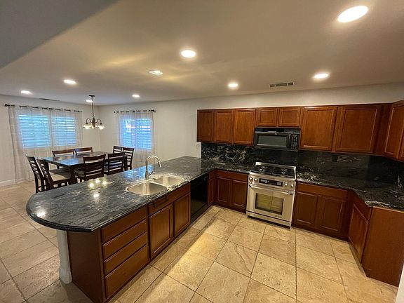 Extensive kitchen countertop space with abundance of cabinet storage.