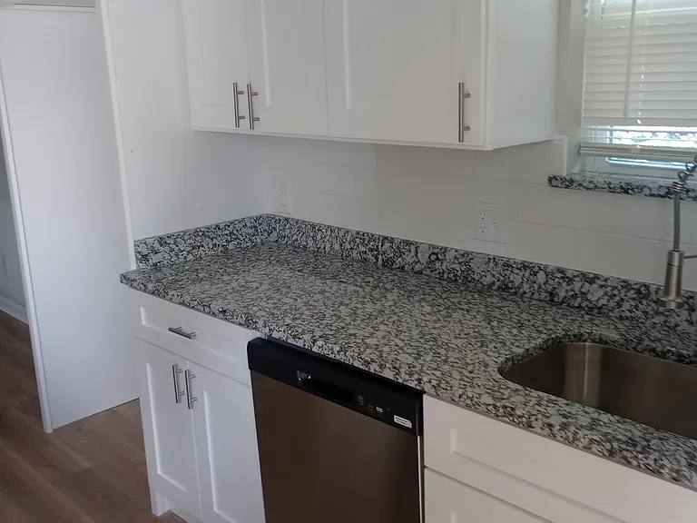 Upstairs Kitchen with brand new dishwasher, granite countertops, and soft close cabinetry. 

Downstairs unit extremely similar.