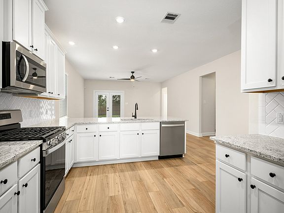 Enjoy a kitchen filled with stainless steel appliances and granite countertops