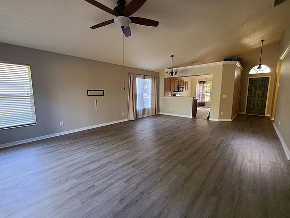 Open floor plan living with brand new vinyl flooring