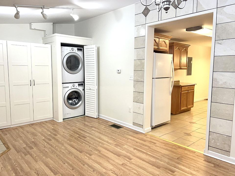 High efficiency washer and dryer in apartment. Handcrafted title work throughout apartment.