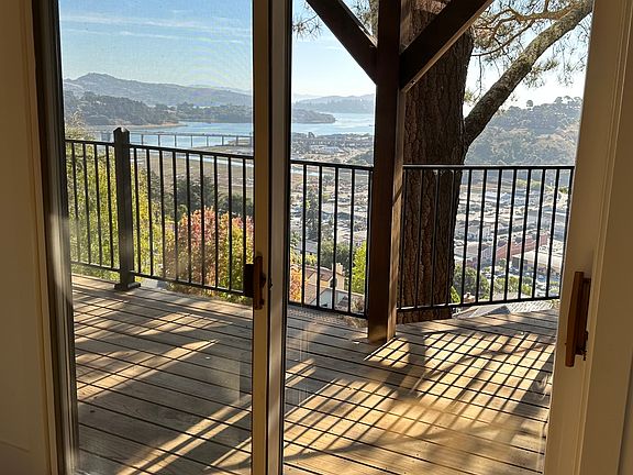 Beautiful Fall day looking out to San Francisco Bay from one of three doorways leading out to the huge deck.