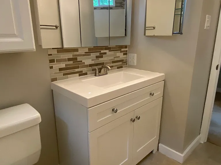 Bathroom sink brushed nickel fixtures
All mirrors have storage