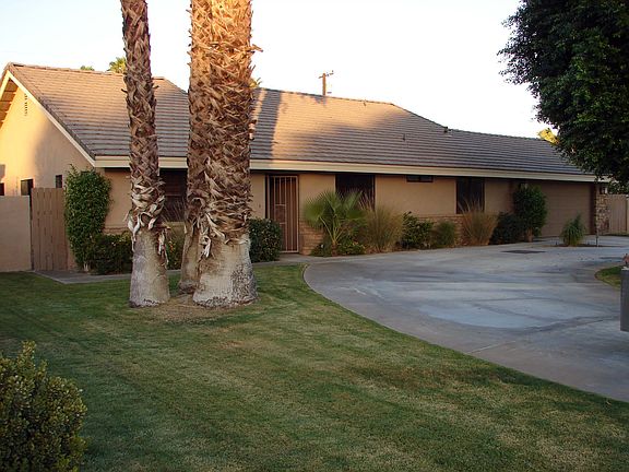 Mature landscaping and circular driveway