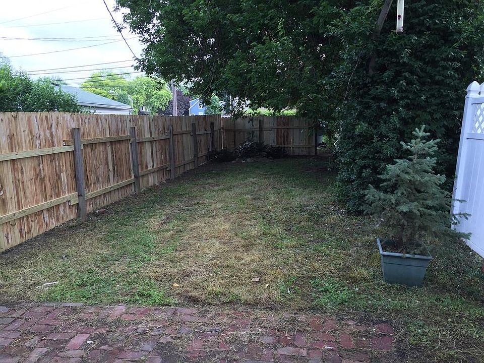 Rear yard, off street parking behind rear fence.