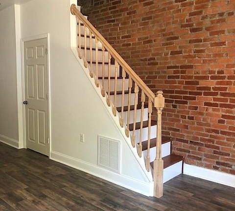 Living Room Stairs and Coat Closet