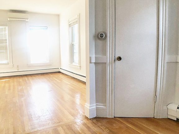 Large dining room and living room with split AC unit installed