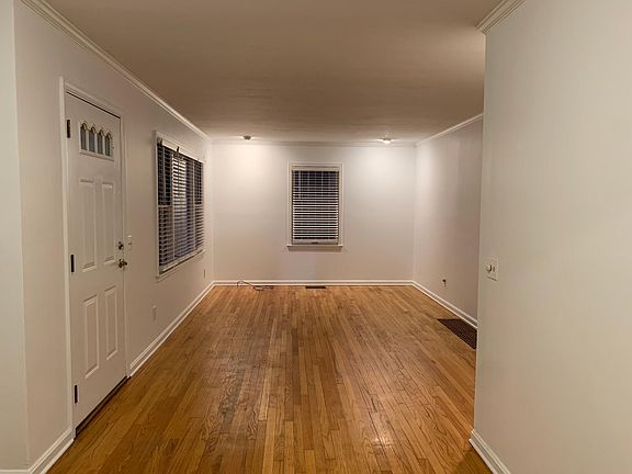Living room with faux wood blinds