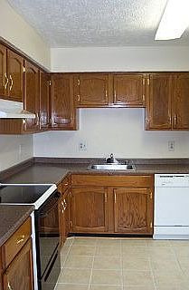 kitchen with new appliances and stone floors